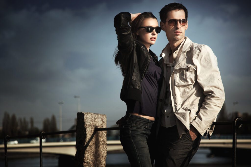 Attractive young couple wearing sunglasses man and woman